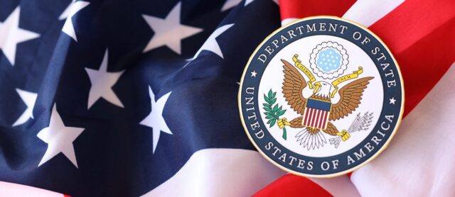 U.S. Department of State seal on the American flag, representing financial planning for Foreign Service Officers